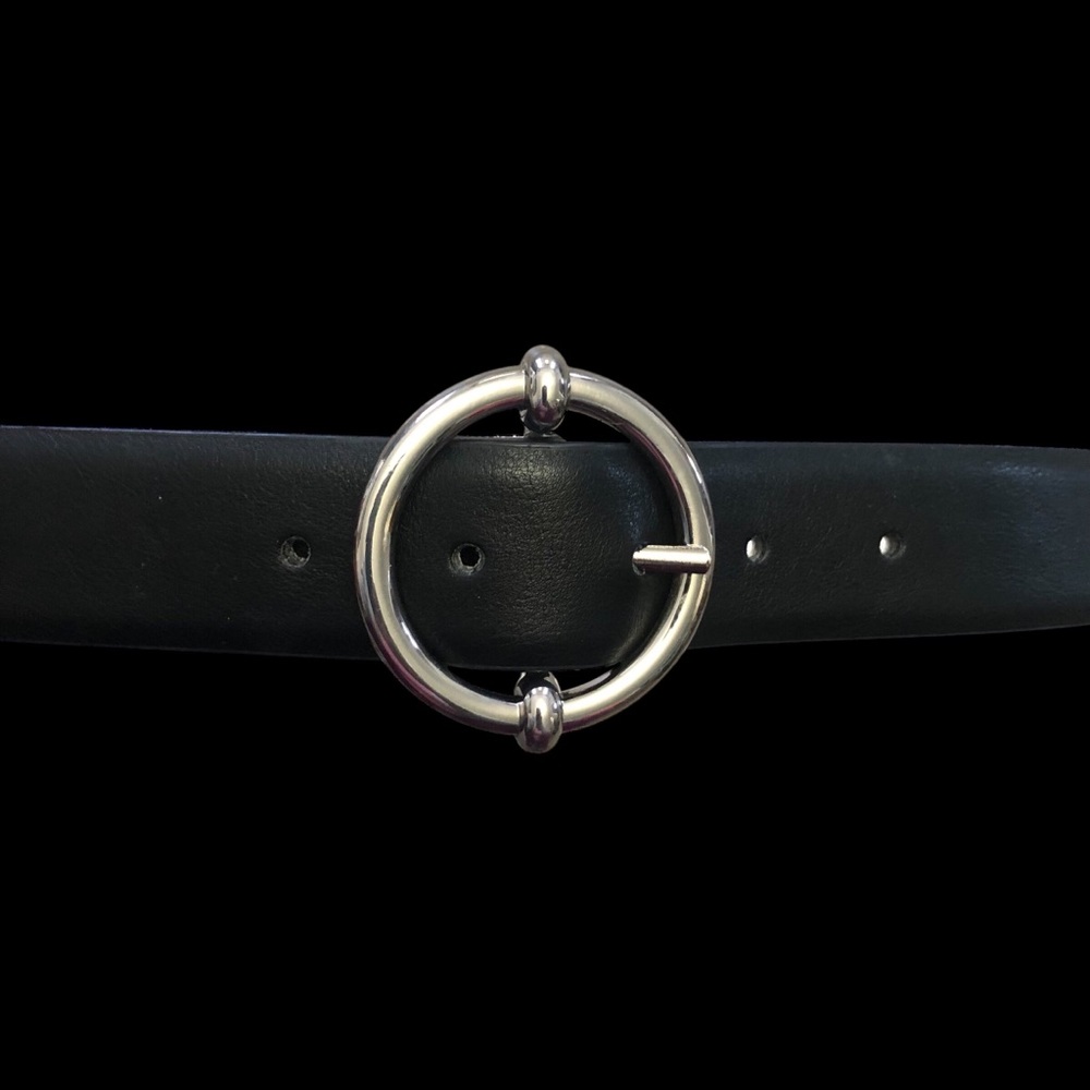 Waist belt in faux leather with a round metal buckle